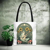 Load image into Gallery viewer, Whimsical Frog Guitarist Tote Bag - Vintage Style Sunflower Mushrooms Moon Phase Design, Music Lover Gift, Boho Chic Shoulder Bag, Nature
